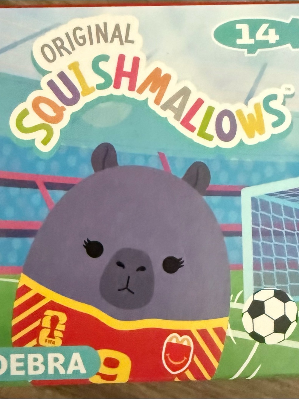 Squishmallows Debra Plush - Purple with Red and Yellow Jersey